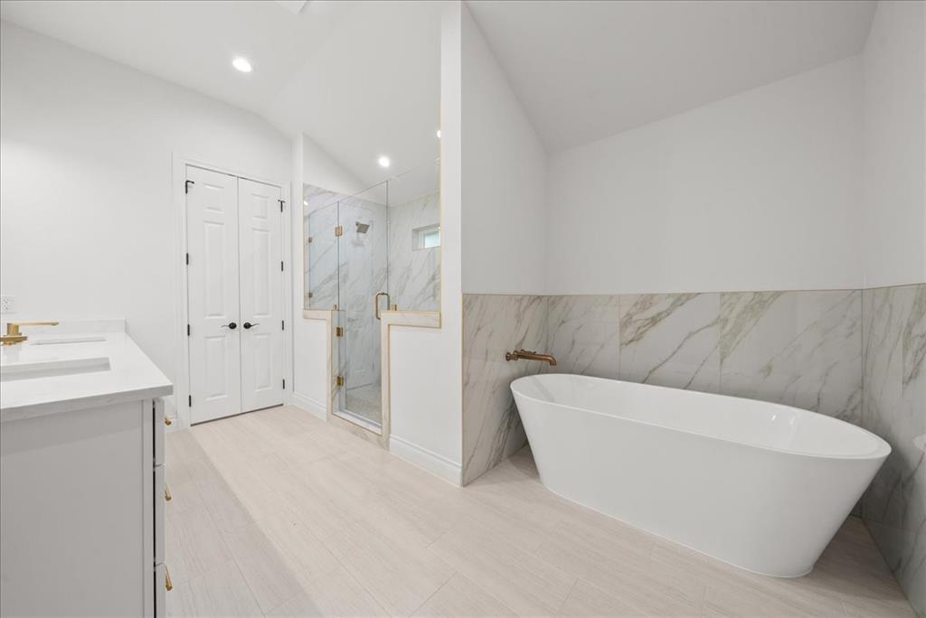 3801 Berry Hill Court Double Oak, TX 75028 - Photo 25 of 33 a bathroom with a tub shower sink and mirror