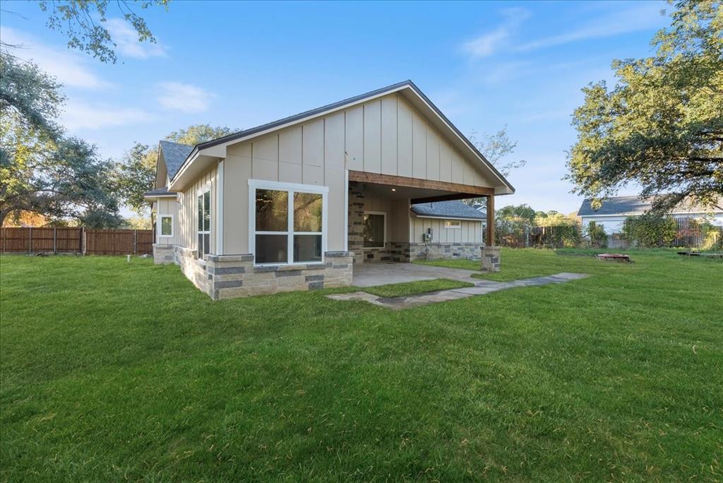 3801 Berry Hill Court Double Oak, TX 75028 - Photo 31 of 33 a front view of house with yard and green space