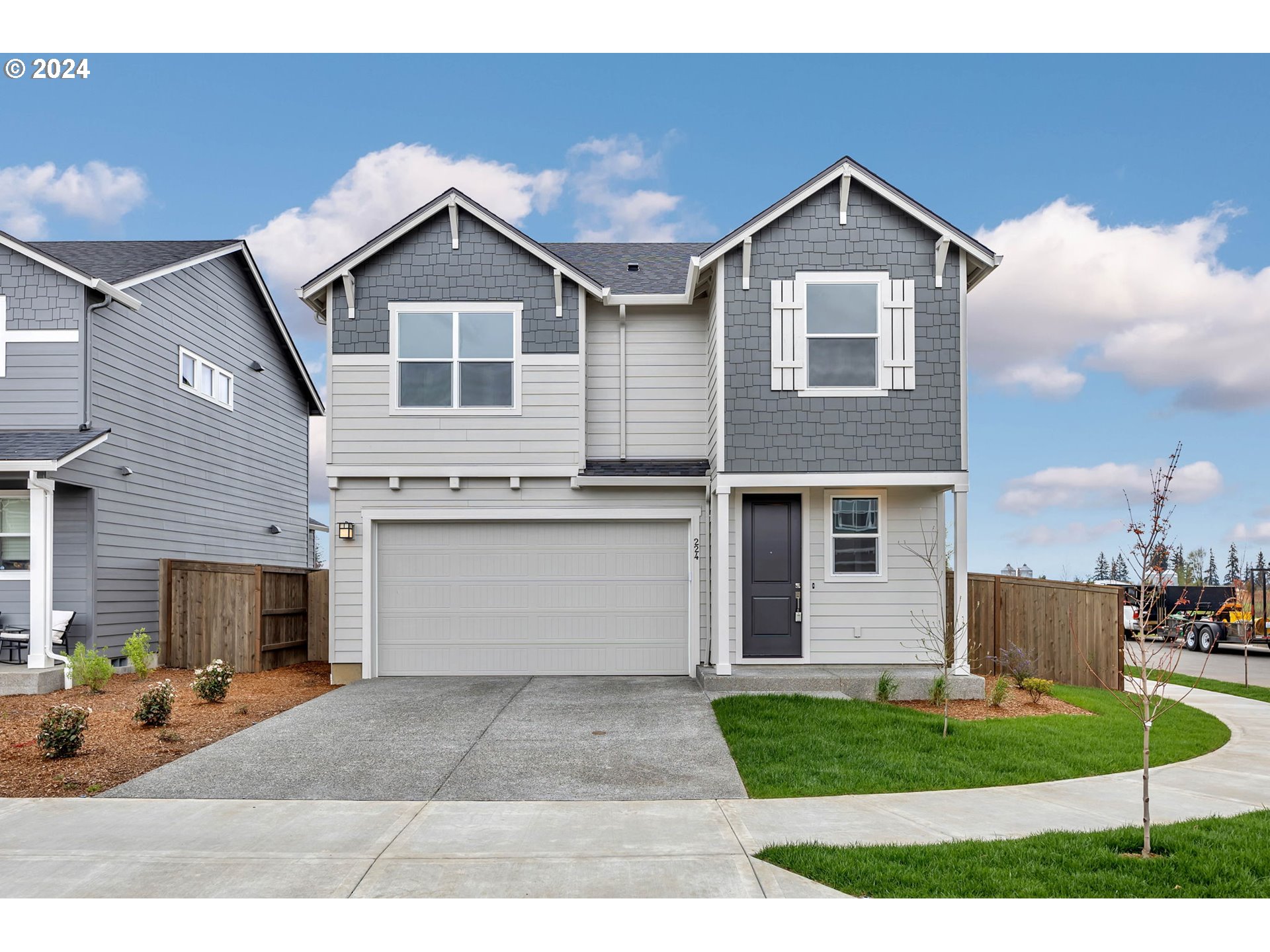 224 North 89th Loop, Unit 85 Ridgefield, WA 98642 - Photo 1 of 32 a front view of a house with garden