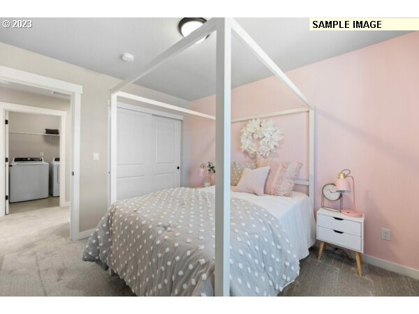224 North 89th Loop, Unit 85 Ridgefield, WA 98642 - Photo 29 of 32 a bedroom with a bed and a couch