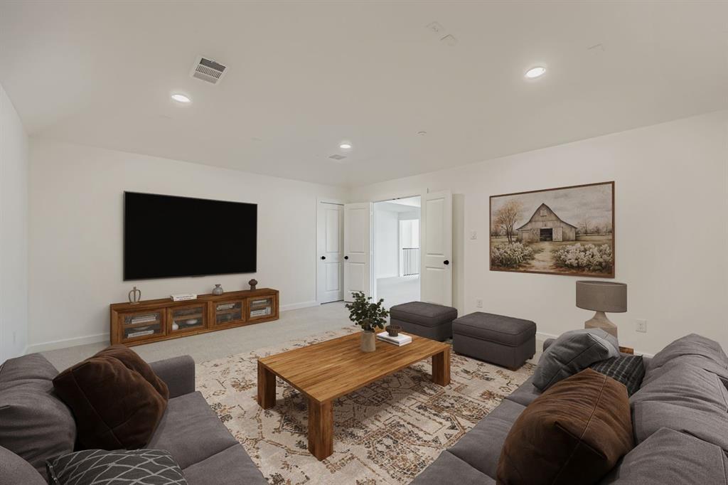 1841 Pk Vista Way Midlothian, TX 76065 - Photo 23 of 28 a living room with furniture and a flat screen tv