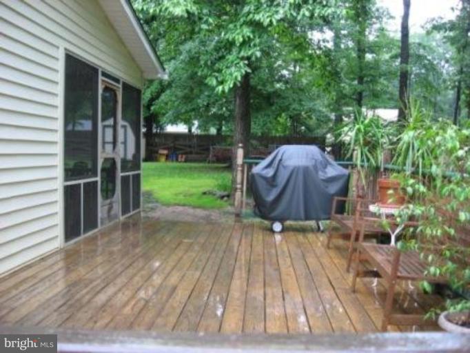 11456 Rawhide Road Lusby, MD 20657 - Photo 2 of 10 a backyard of a house with lots of green space
