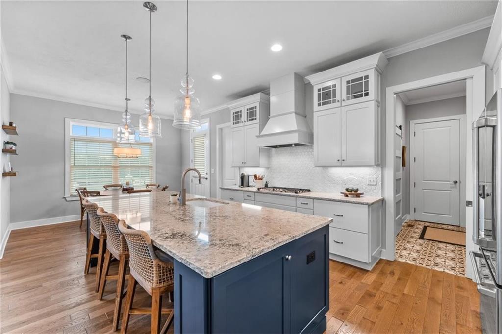 134 Pearce Road Mars, PA 16046 - Photo 7 of 25 a kitchen with stainless steel appliances granite countertop a stove a sink a refrigerator a dining table and chairs