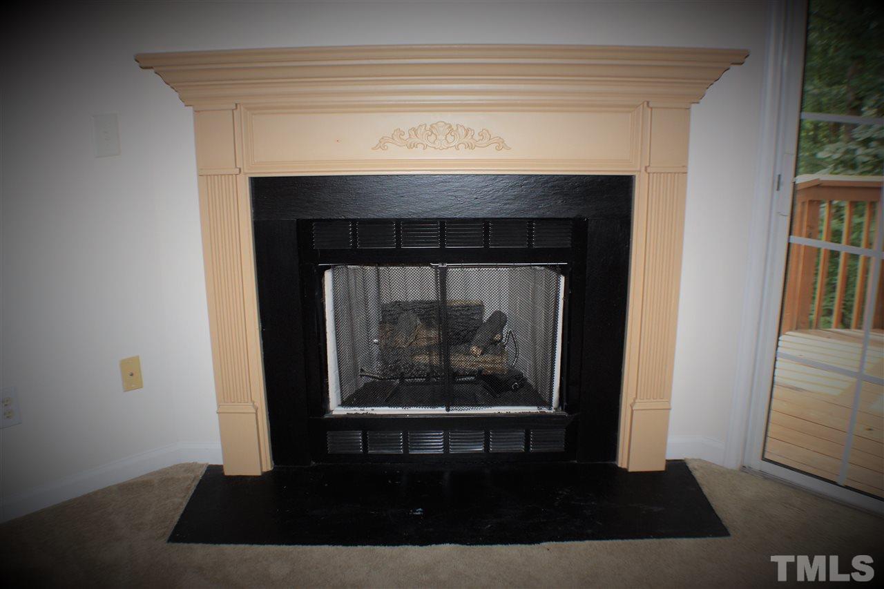 4750 Black Mountain Path Raleigh, NC 27612 - Photo 12 of 30 a living room with a fireplace