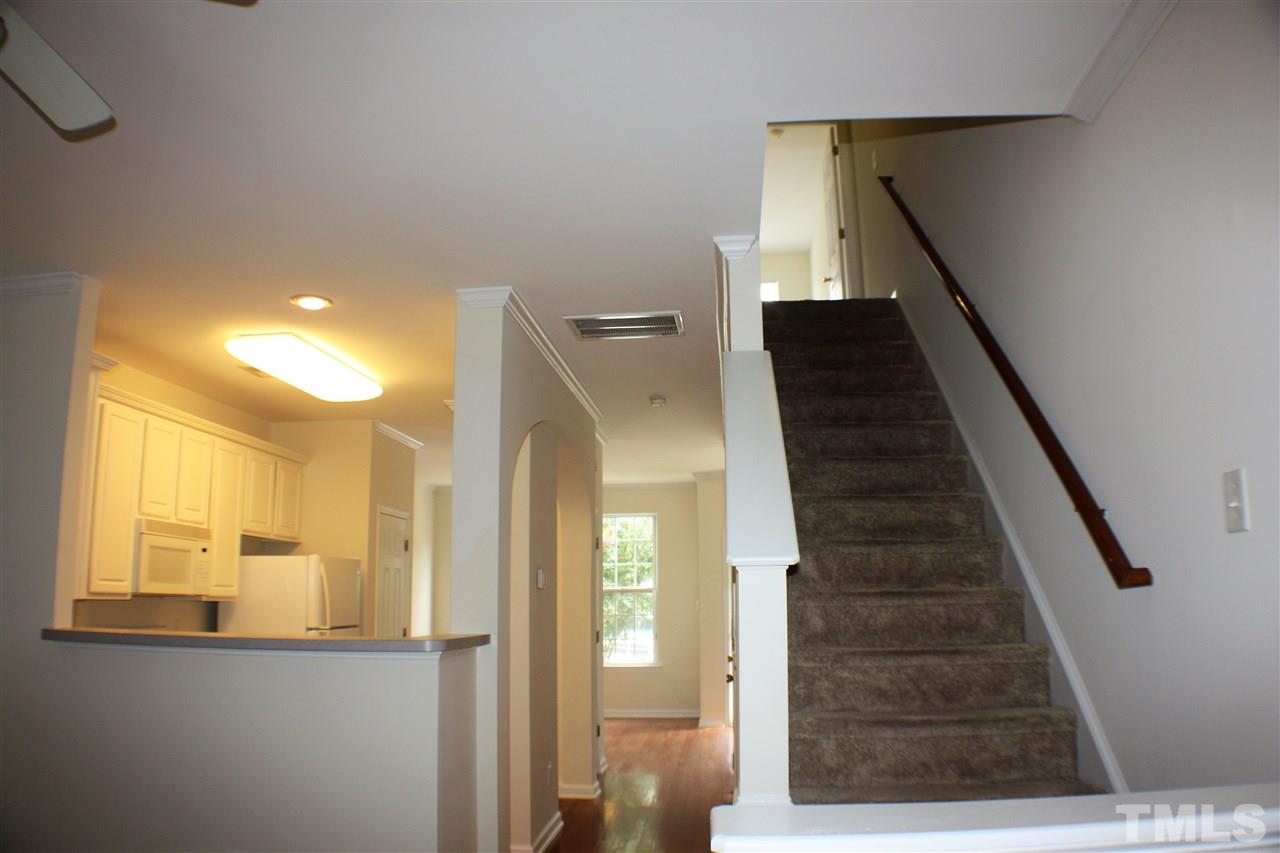4750 Black Mountain Path Raleigh, NC 27612 - Photo 13 of 30 a view of a hallway with wooden floor and staircase