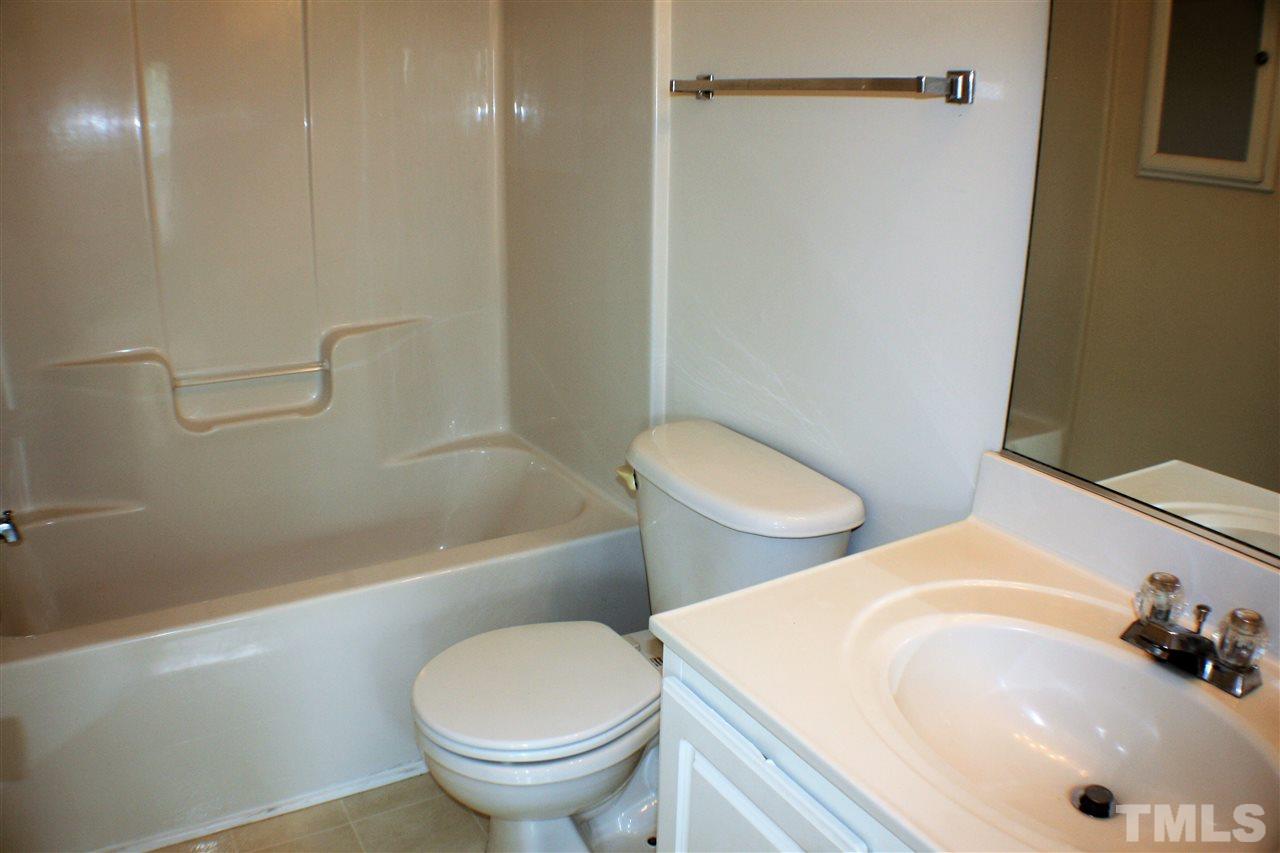 4750 Black Mountain Path Raleigh, NC 27612 - Photo 20 of 30 a bathroom with a sink a toilet and bathtub