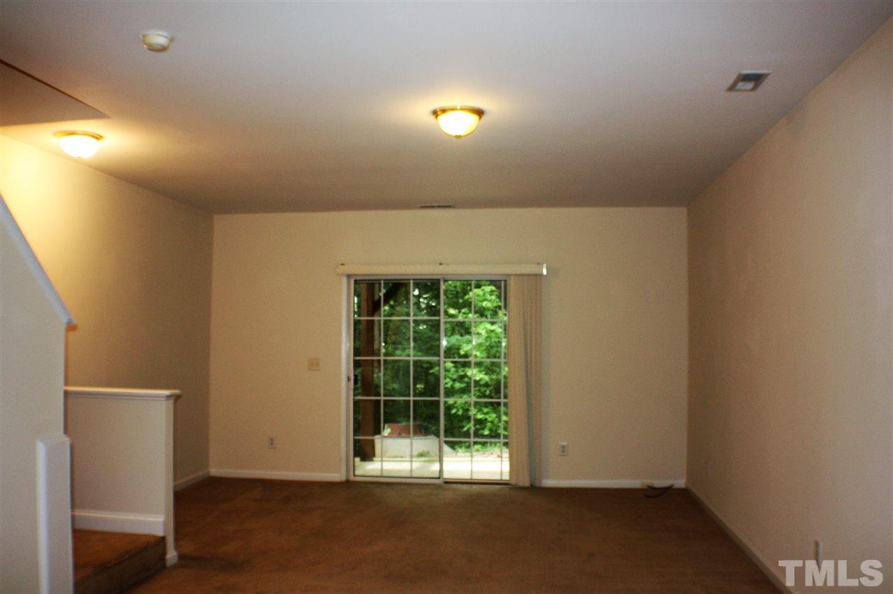 4750 Black Mountain Path Raleigh, NC 27612 - Photo 23 of 30 an empty room with wooden floor and windows