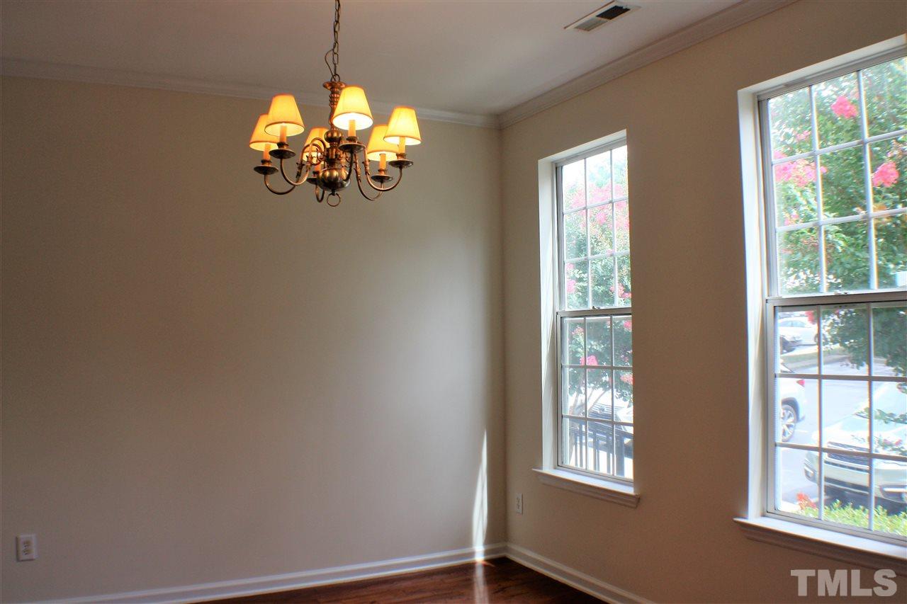 4750 Black Mountain Path Raleigh, NC 27612 - Photo 6 of 30 a view of a chandelier fan and wooden floor