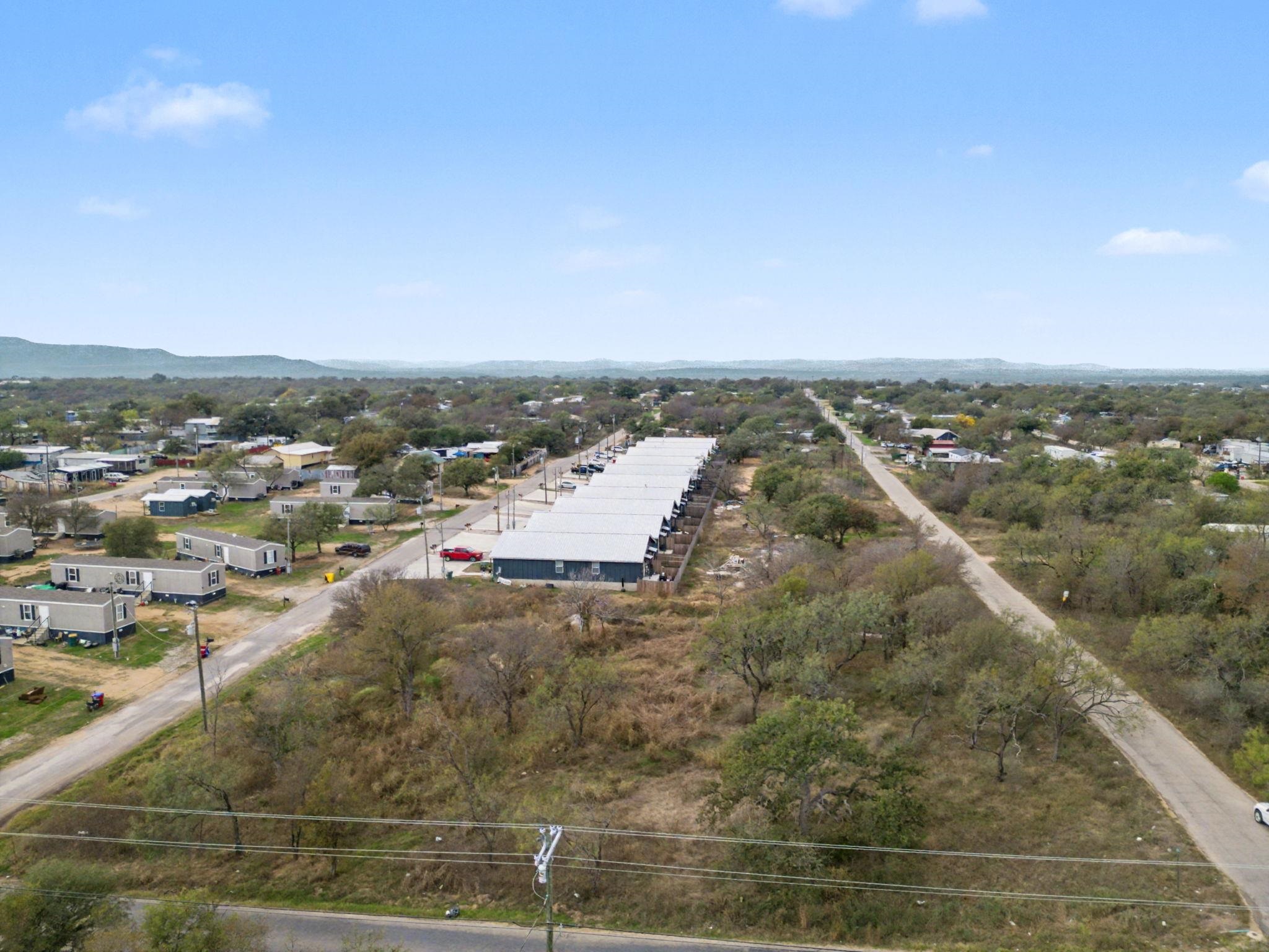 Lot 353 Anson Kingsland, TX 78639 - Photo 11 of 13 an aerial view of residential houses with outdoor space
