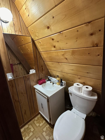1456 Navajo Road Coalville, UT 84017 - Photo 33 of 55 Bathroom with vanity, wood walls, and a vaulted wooden ceiling