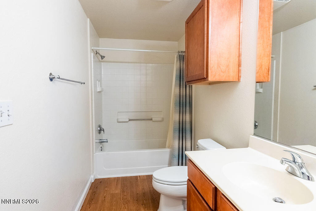 9050 Double R Boulevard, Unit 212 Reno, NV 89521 - Photo 19 of 33 a bathroom with a sink toilet and shower