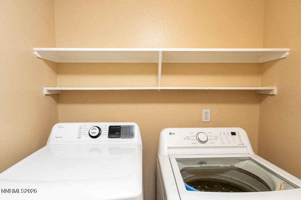 9050 Double R Boulevard, Unit 212 Reno, NV 89521 - Photo 22 of 33 a utility room with dryer and washer