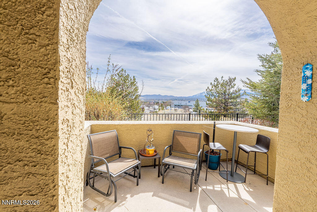 9050 Double R Boulevard, Unit 212 Reno, NV 89521 - Photo 25 of 33 a view of a chairs and table in patio