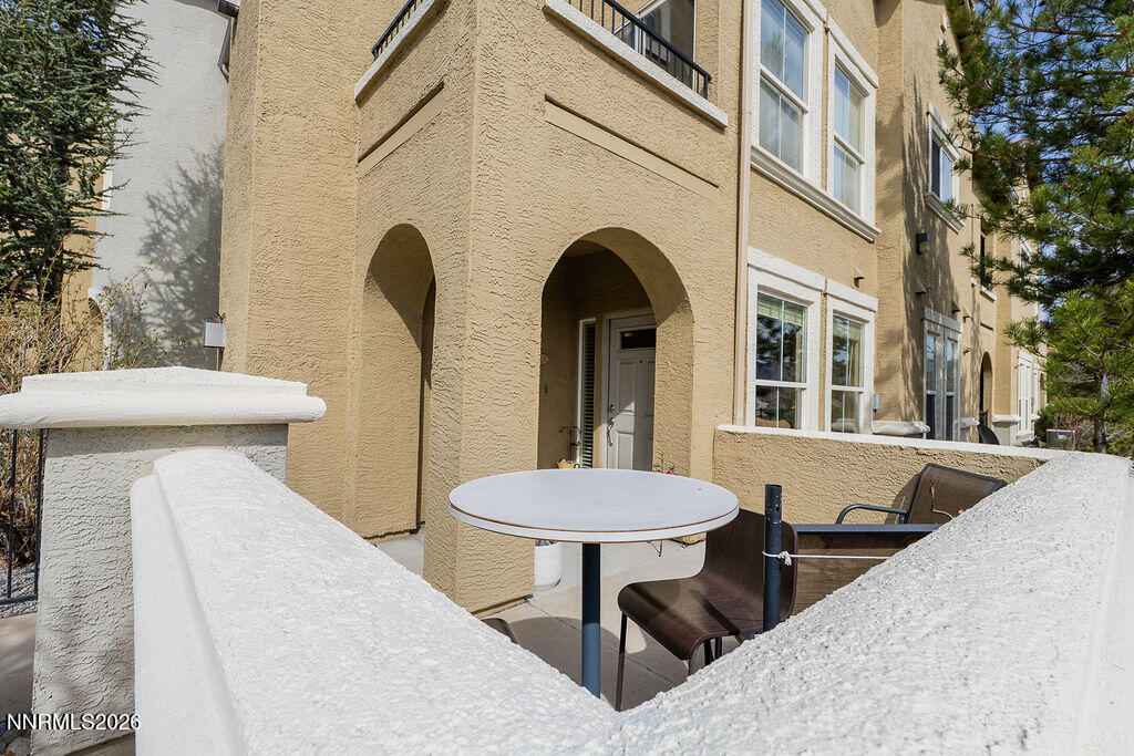 9050 Double R Boulevard, Unit 212 Reno, NV 89521 - Photo 27 of 33 a view of a patio with a table and chairs