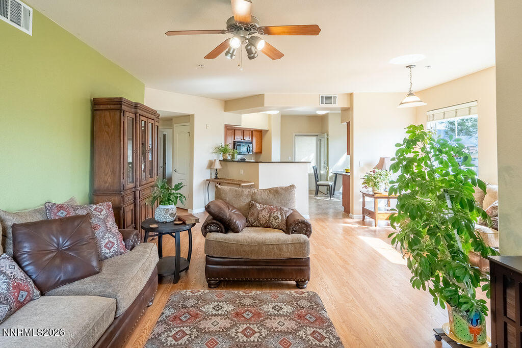 9050 Double R Boulevard, Unit 212 Reno, NV 89521 - Photo 5 of 33 a living room with furniture and a potted plant