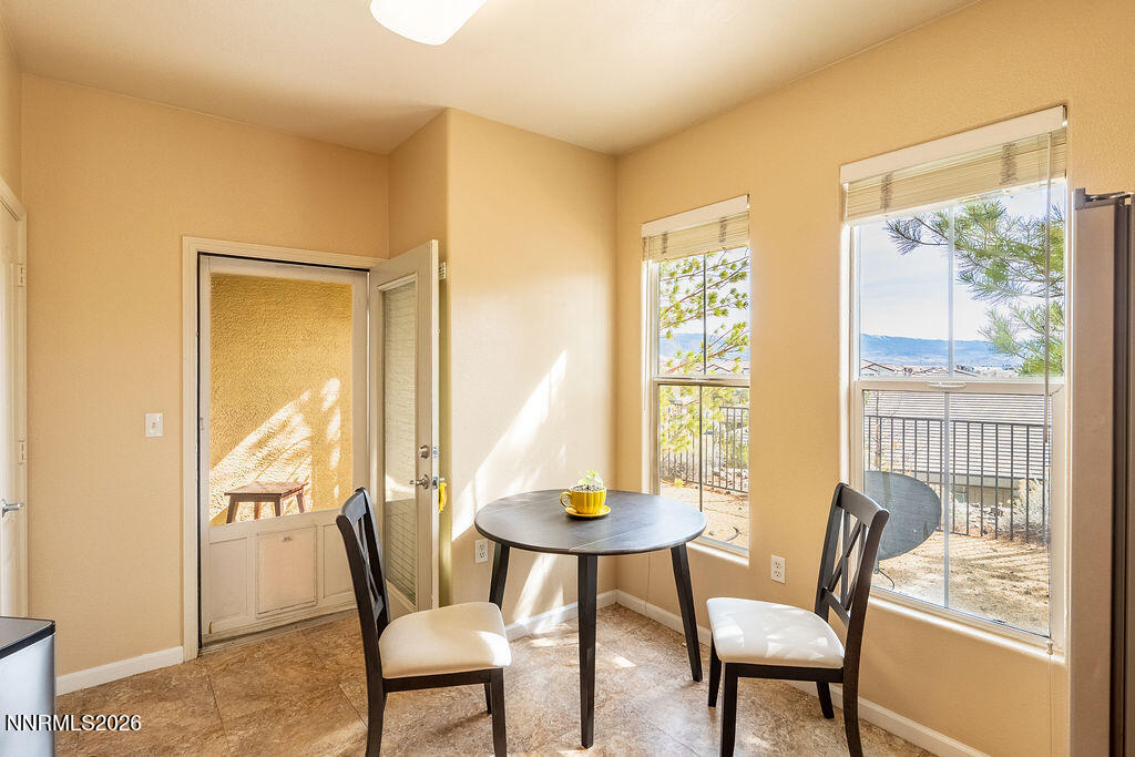 9050 Double R Boulevard, Unit 212 Reno, NV 89521 - Photo 8 of 33 a view of a dining room with furniture window and outside view