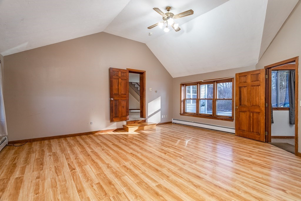 54 Longley Road Shirley, MA 01464 - Photo 8 of 42 a view of empty room with wooden floor and fan