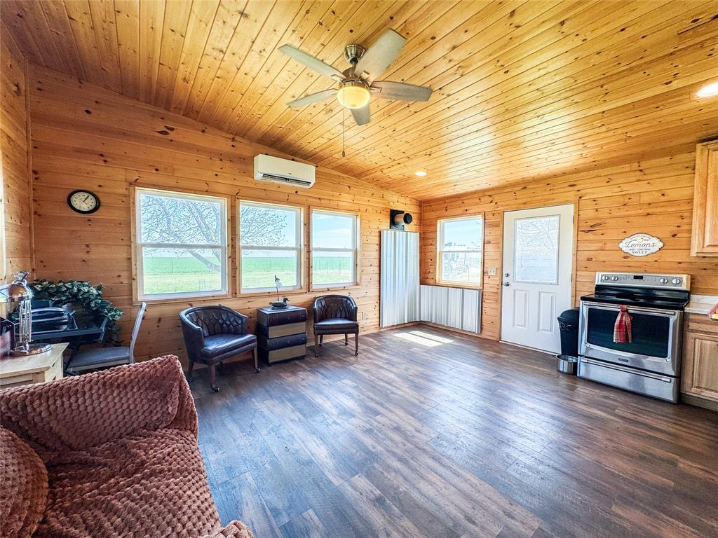 1209 Taylor Avenue Rule, TX 79547 - Photo 5 of 40 a living room with furniture and wooden floor