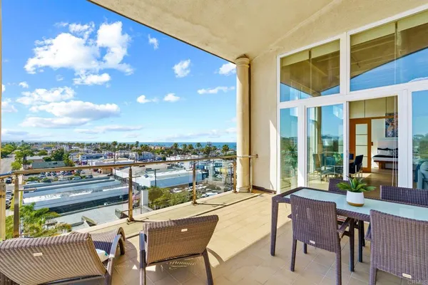 a view of a terrace with furniture and garden view