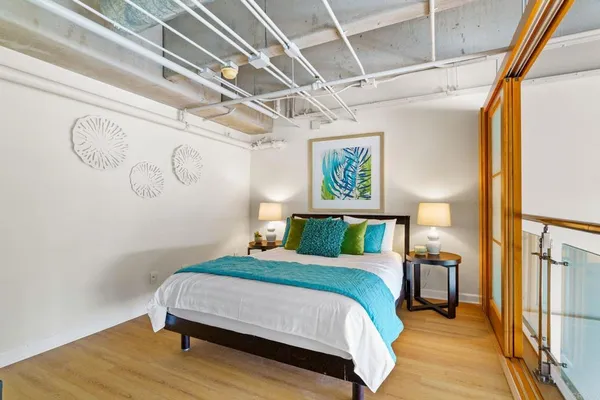 a bedroom with a bed and a table