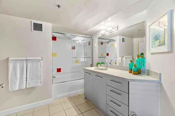 a utility room with cabinets washer and dryer