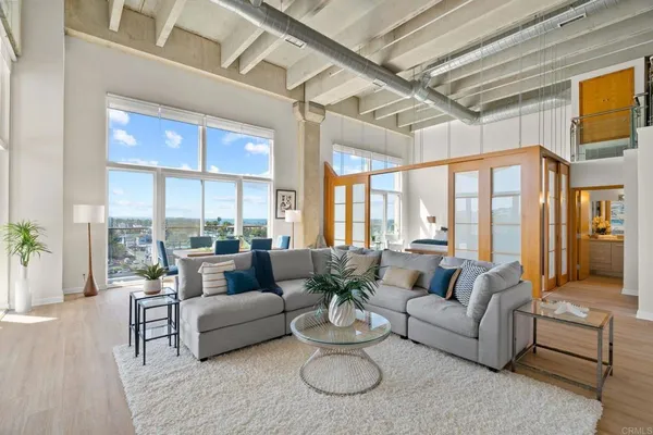 a living room with furniture and a large window