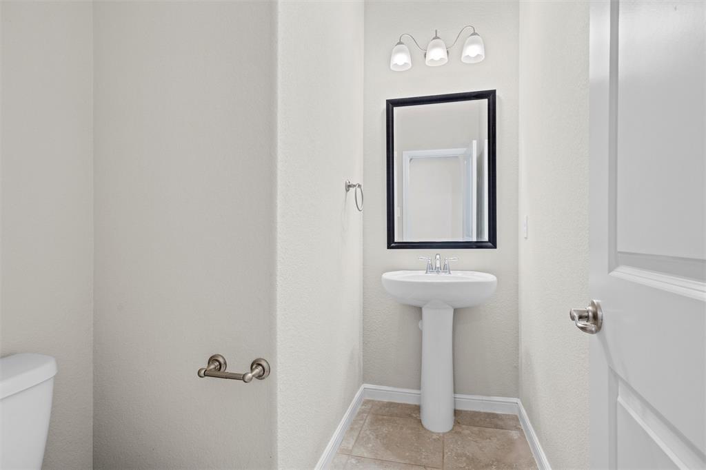 912 Falcon Road Argyle, TX 76226 - Photo 22 of 40 Powder Bath on first floor