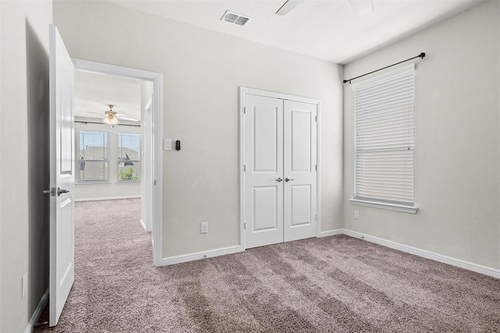 912 Falcon Road Argyle, TX 76226 - Photo 29 of 40 First bedroom with ceiling fan.