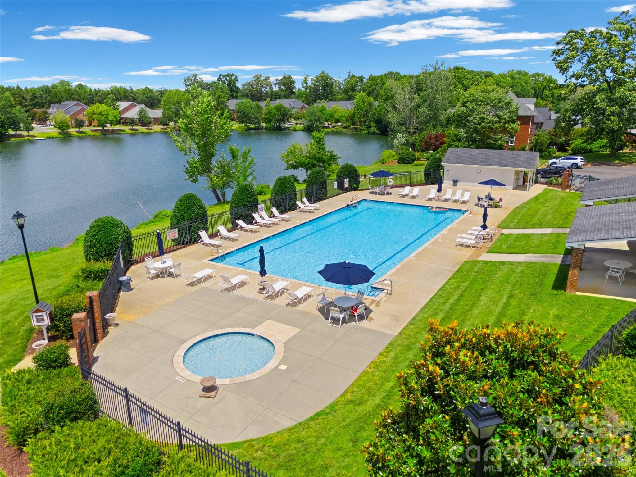 636 Landsdowne Court Fort Mill, SC 29708 - Photo 44 of 48 an aerial view of a house with swimming pool and lake view