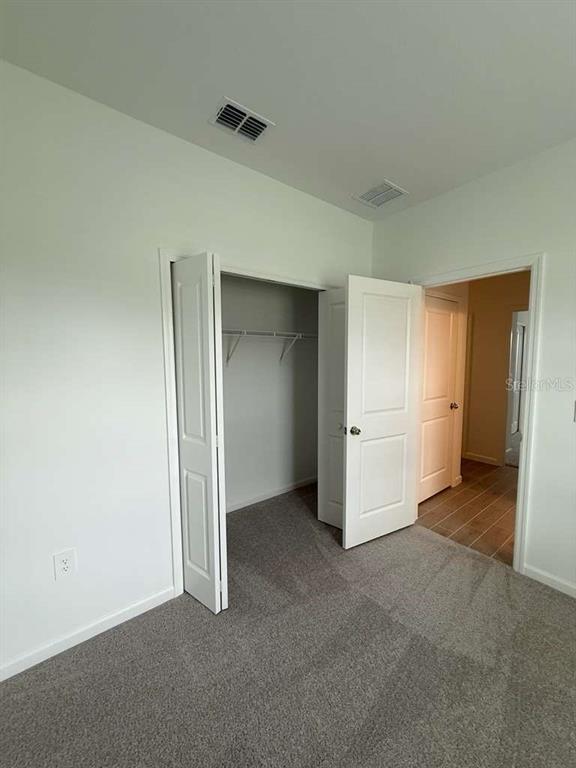 6882 Southwest 89th Lane Ocala, FL 34476 - Photo 13 of 16 an empty room with closet area