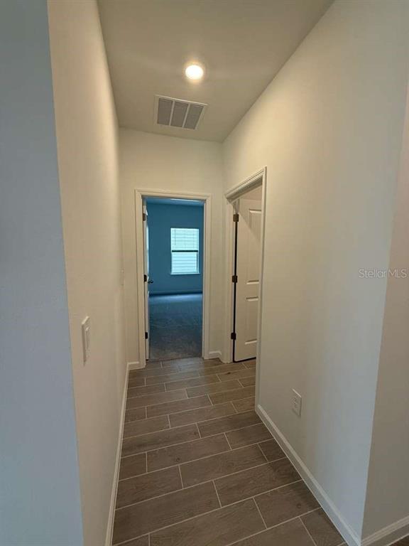 6882 Southwest 89th Lane Ocala, FL 34476 - Photo 14 of 16 a view of hallway with mirror