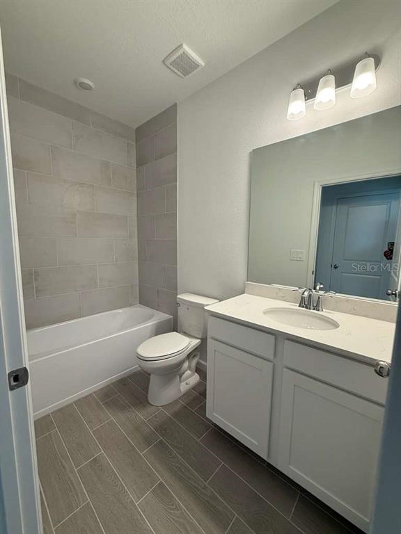 6882 Southwest 89th Lane Ocala, FL 34476 - Photo 16 of 16 a bathroom with a double vanity sink toilet and shower