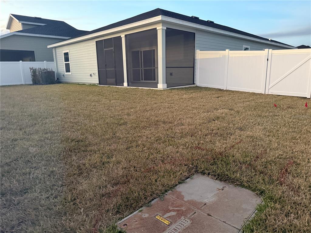 6882 Southwest 89th Lane Ocala, FL 34476 - Photo 17 of 22 a view of a house with a yard