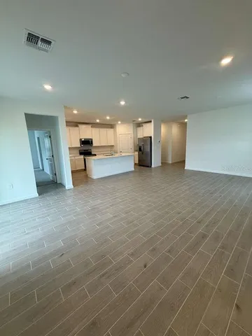 a view of a kitchen with a sink and cabinets