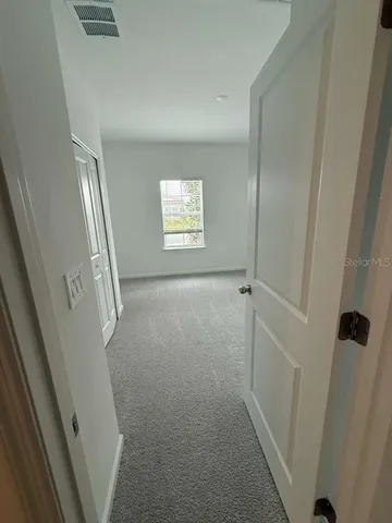 a view of a room with an empty space