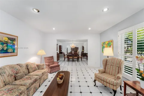 a living room with furniture and a table