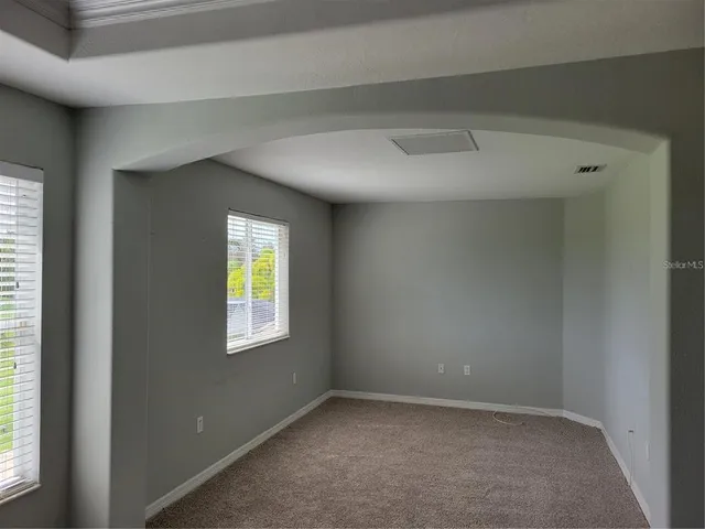 an empty room with windows