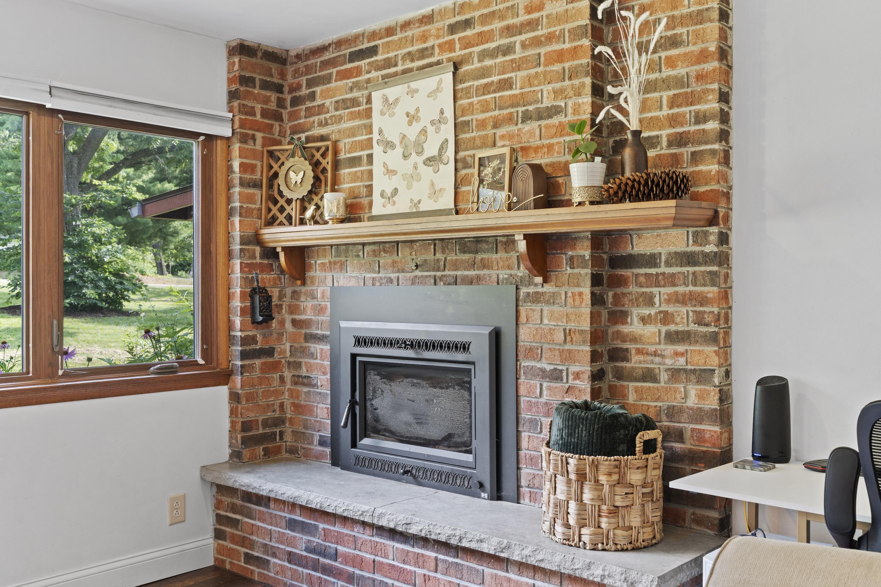 N8093 Lakeview Road Oconomowoc, WI 53066 - Photo 18 of 44 Wood burning insert in your cozy family room!