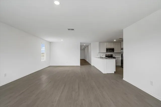 a view of a kitchen with a sink cabinets and a refrigerator