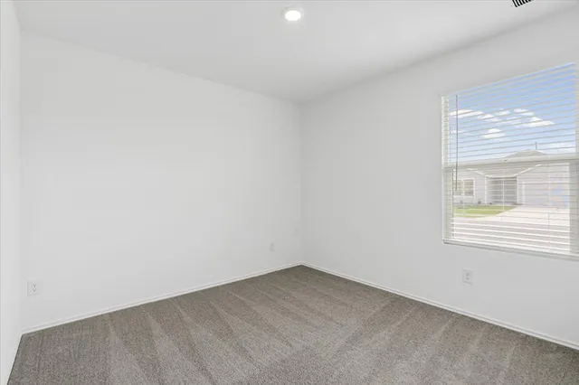 a kitchen with stainless steel appliances granite countertop a sink dishwasher a stove and a microwave oven with cabinets