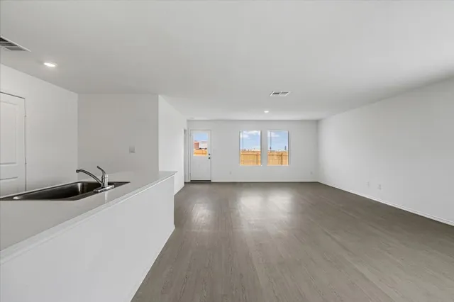 a kitchen with stainless steel appliances granite countertop a stove and a refrigerator