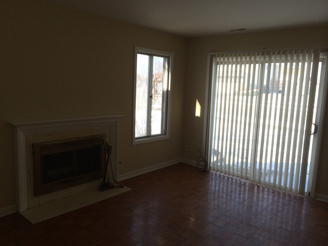 17 Churn Road, Unit 23 Matteson, IL 60443 - Photo 2 of 17 a view of an empty room with wooden floor and a window