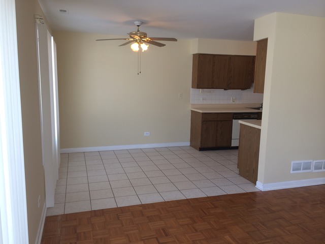 17 Churn Road, Unit 23 Matteson, IL 60443 - Photo 4 of 17 a view of an empty room with a fireplace