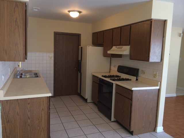 17 Churn Road, Unit 23 Matteson, IL 60443 - Photo 6 of 17 a kitchen with stainless steel appliances granite countertop a refrigerator and a sink