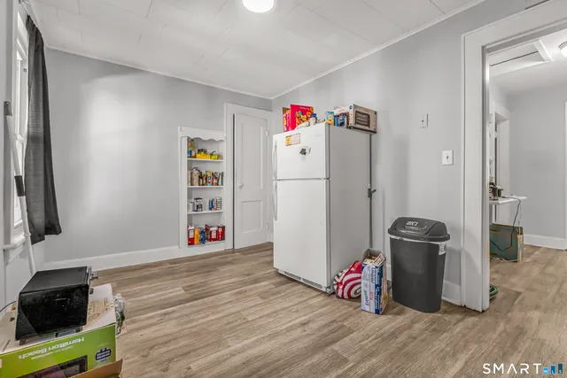 a white refrigerator freezer sitting inside of a kitchen