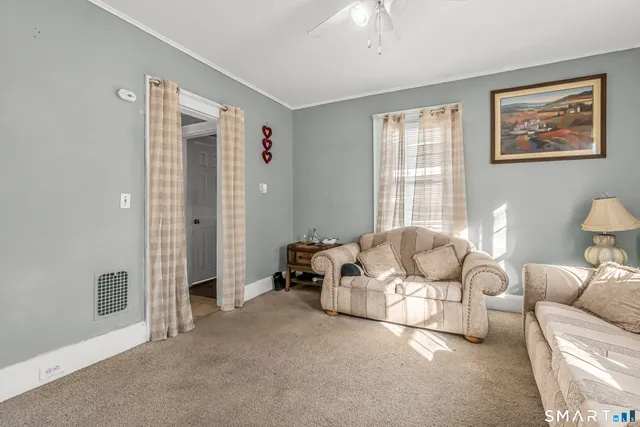 a living room with furniture and a window