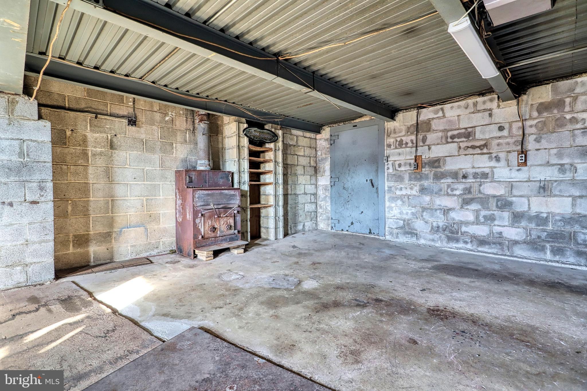 4715 Fake Road York, PA 17406 - Photo 46 of 65 Wood Stove in 2 carattached garage can heat house.