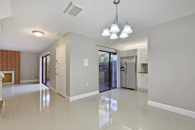 a view of a livingroom with a chandelier fan