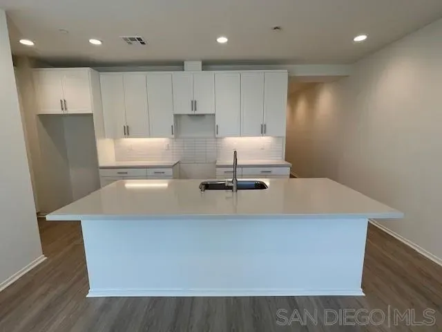 a view of kitchen with wooden floor