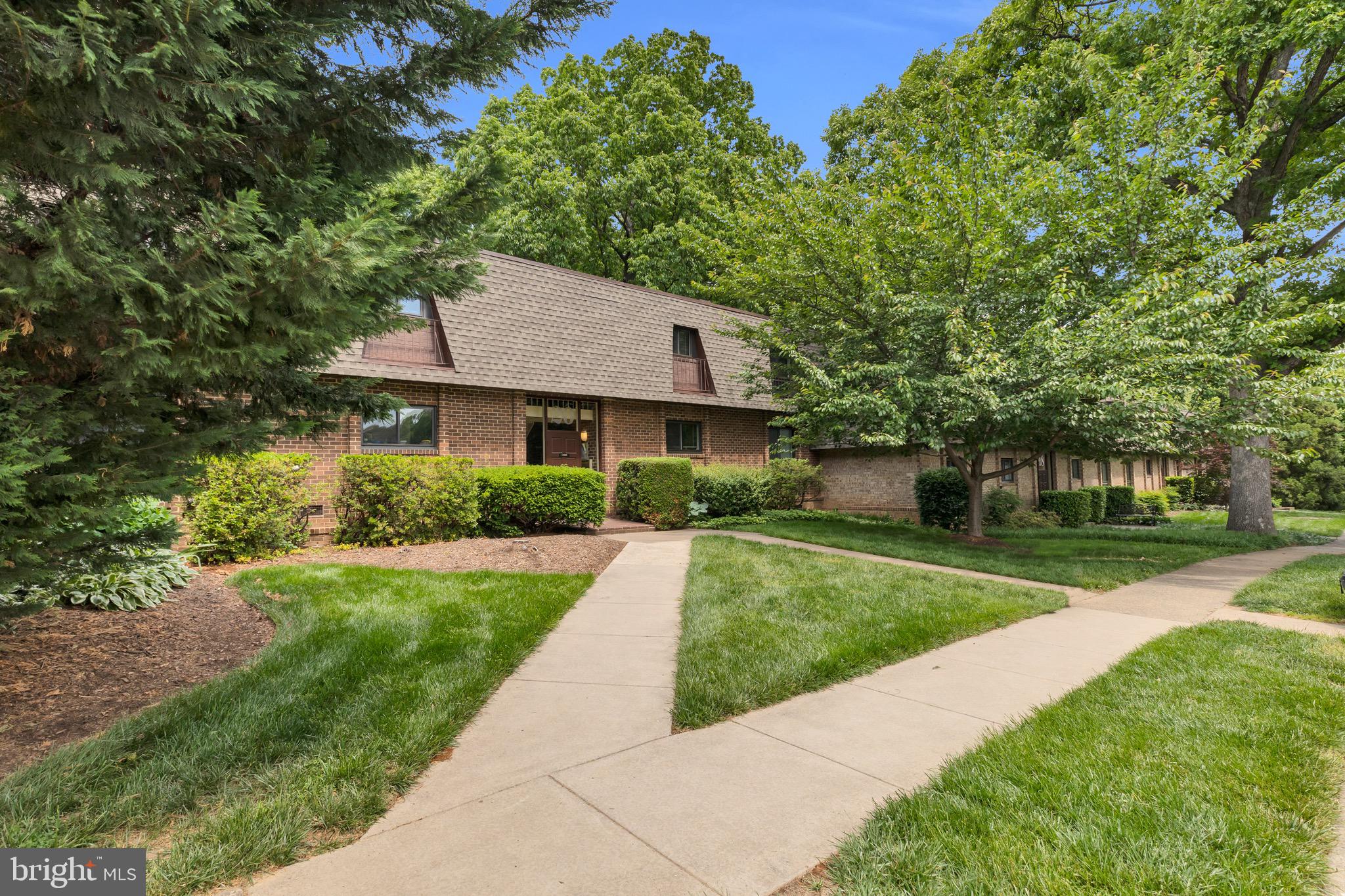 11620 Vantage Hill Road, Unit 22B Reston, VA 20190 - Photo 2 of 24 a front view of a house with yard
